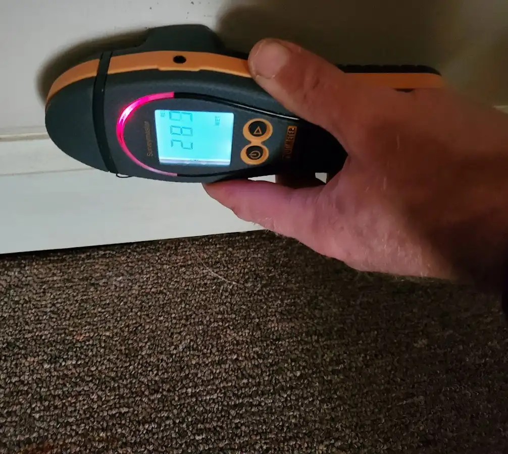Moisture detection at baseboard during Storm Damage Restoration in Shamong